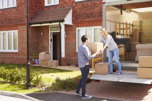 Professional moving team loading furniture for a Hatton property