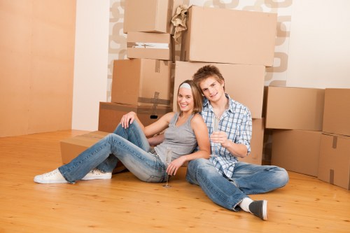 Packed moving boxes and furniture prepared for transport in Hatton