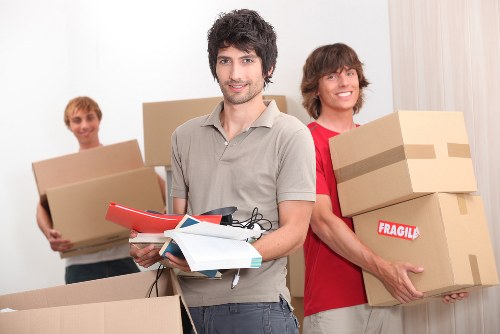 Office relocation team handling desks and equipment in Hatton