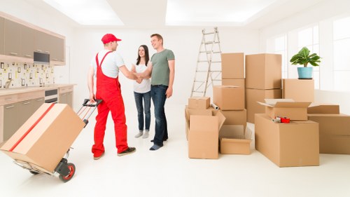 Worker securing items inside a moving van