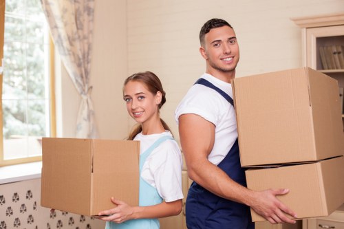 Local moving team loading furniture into a van in Hatton